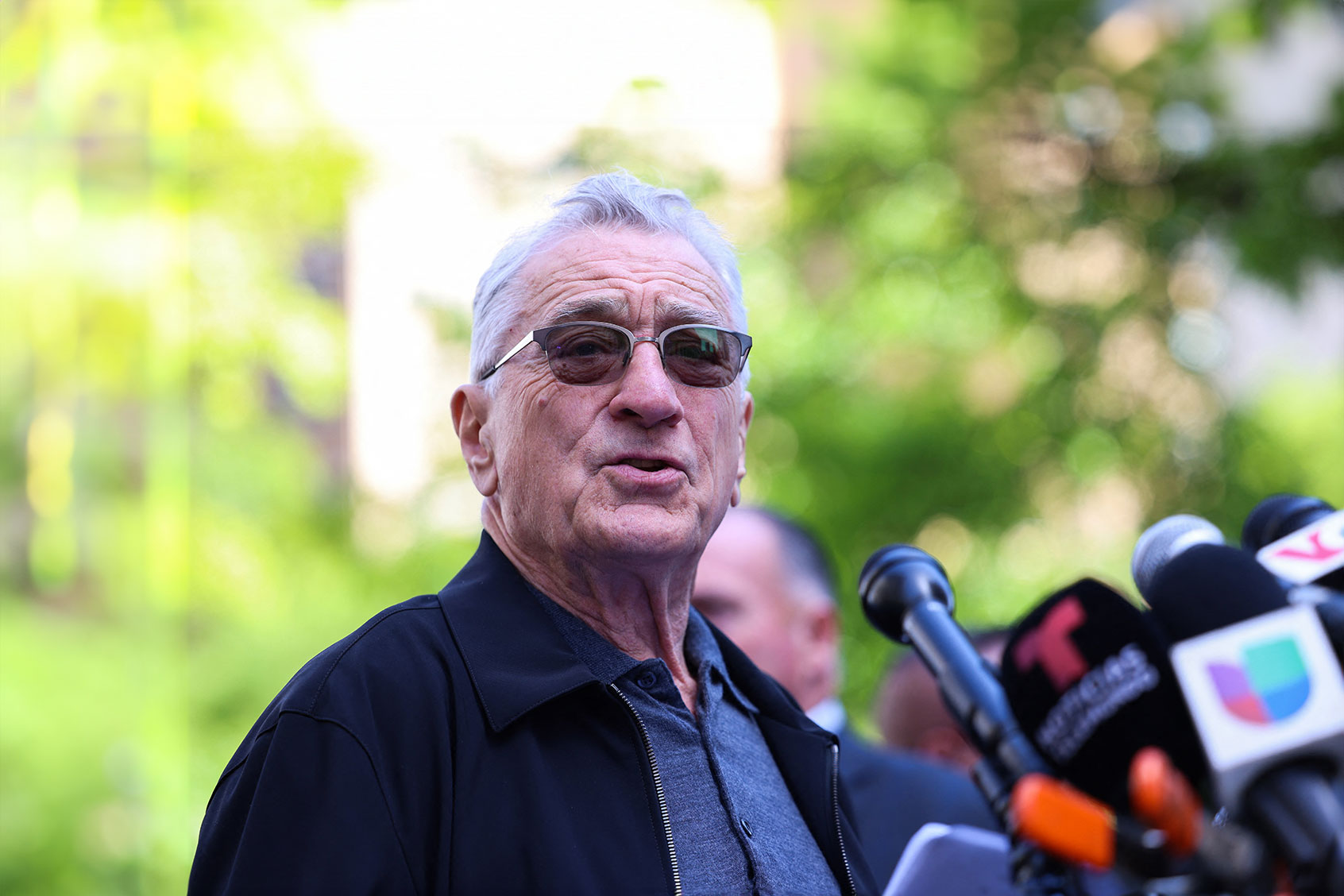 US actor Robert De Niro speaks in support of US President Joe Biden outside of Manhattan Criminal Court as former US President and Republican presidential candidate Donald Trump attends his criminal trial for allegedly covering up hush money payments in New York City, on May 28, 2024. (CHARLY TRIBALLEAU/AFP via Getty Images)
