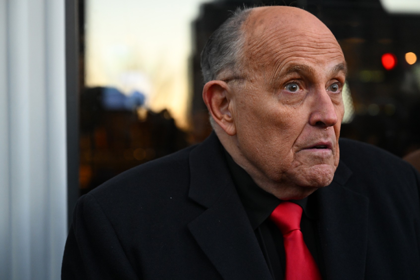 Rudy Giuliani speaks to the media as he arrives at the Farm Bar and Grill where a Florida Governor Ron DeSantis event was originally going to be held on Sunday January 21, 2024 in Manchester, NH. (Matt McClain/The Washington Post via Getty Images)