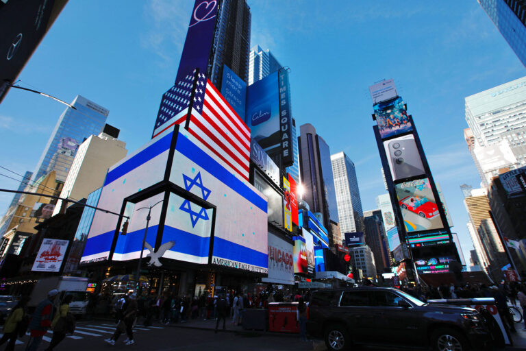 A screen displays U.S. and Israeli flags in Times Square, New York, Oct. 13, 2023. (Kena Betancur/AFP via Getty Images)