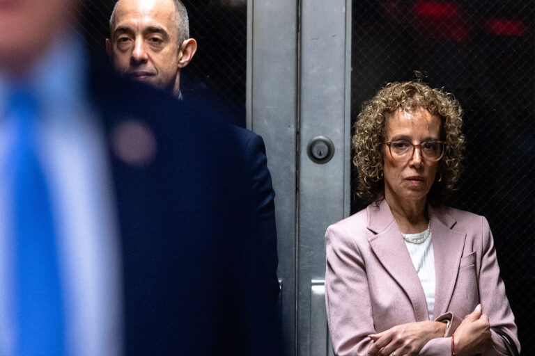 Attorneys Emily Bove (L) and Susan Necheles (R) watch as former US President Donald Trump speaks to the press as he arrives at his trial for allegedly covering up hush money payments linked to extramarital affairs, at Manhattan Criminal Court in New York City on April 26, 2024. (MICHAEL M. SANTIAGO/POOL/AFP via Getty Images)