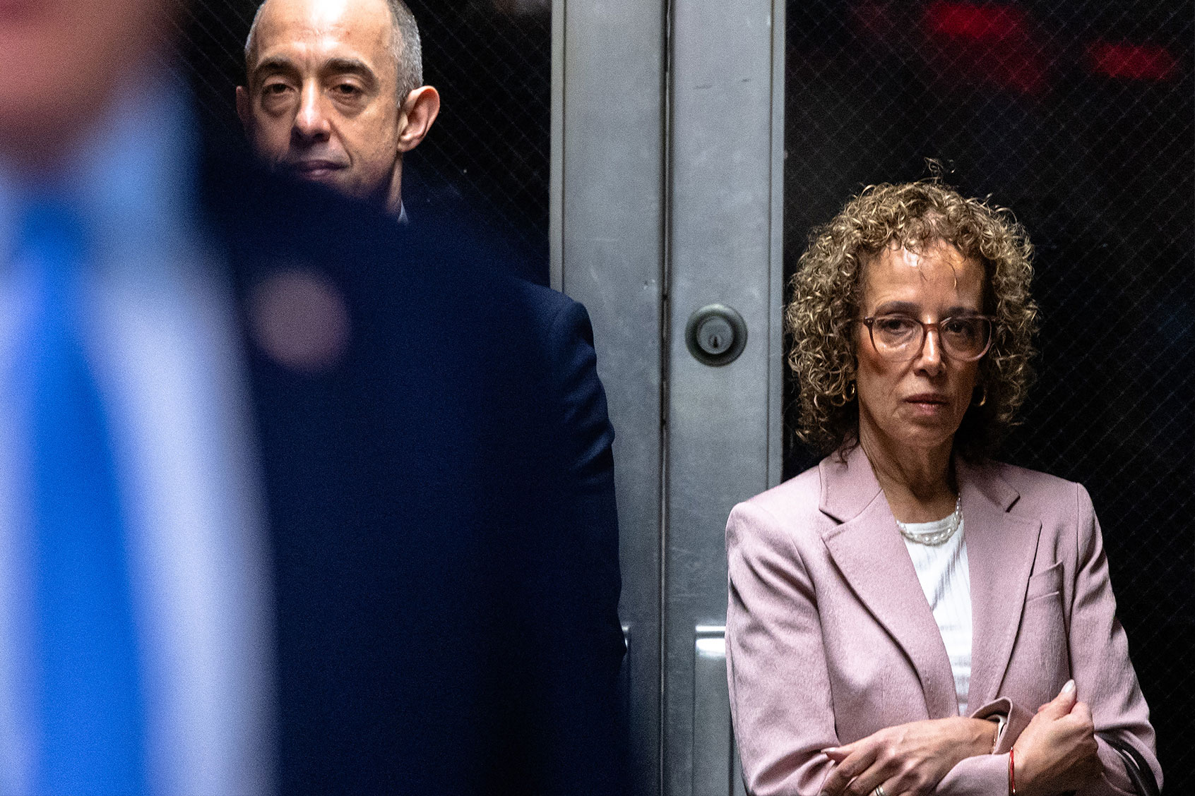 Attorneys Emily Bove (L) and Susan Necheles (R) watch as former US President Donald Trump speaks to the press as he arrives at his trial for allegedly covering up hush money payments linked to extramarital affairs, at Manhattan Criminal Court in New York City on April 26, 2024. (MICHAEL M. SANTIAGO/POOL/AFP via Getty Images)