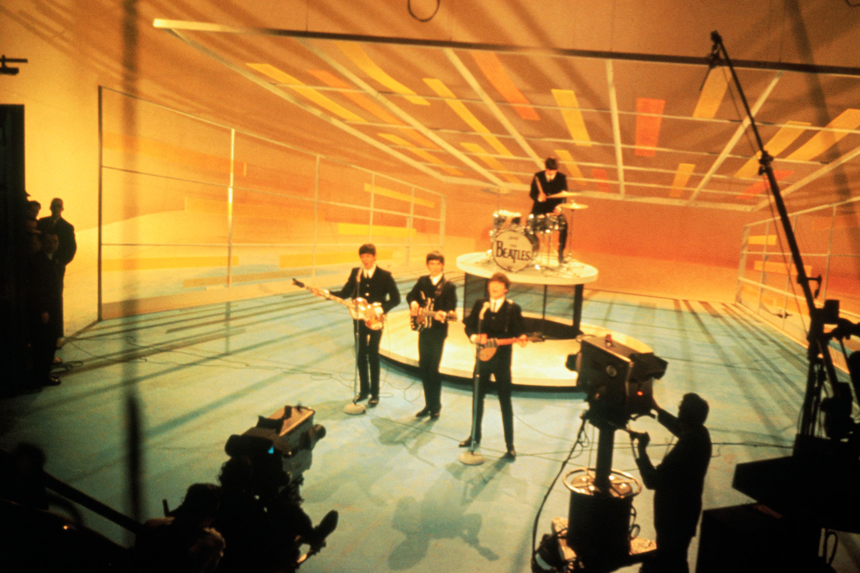 The Beatles during a performance taping for the Ed Sullivan Show in 1964. (Getty Images/	Bettmann)