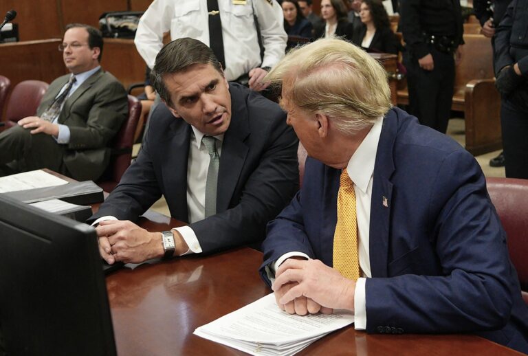 Former President Donald Trump speaks with lawyer Todd Blanche before Trump's trial for allegedly covering up hush money payments linked to extramarital affairs, at Manhattan Criminal Court in New York City, on May 14, 2024. (CURTIS MEANS/POOL/AFP via Getty Images)