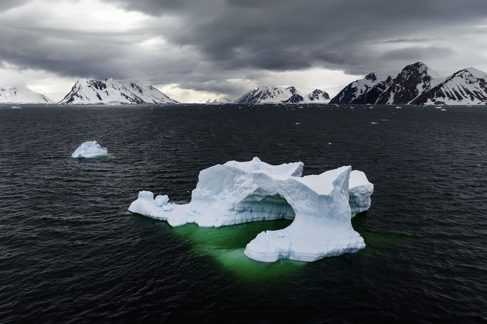 An aerial view of an iceberg while scientists conduct a research on effects of climate change during 8th National Antarctic Science Expedition organized by TUBTAK MAM Polar Research Institute as they have discovered that ice cuticles, sized as much as Turkiye, melted due to the effects of climate change in Antarctica, which is described as the coldest and driest continent of the planet on February 8, 2024. (Sebnem Coskun/Anadolu via Getty Images)