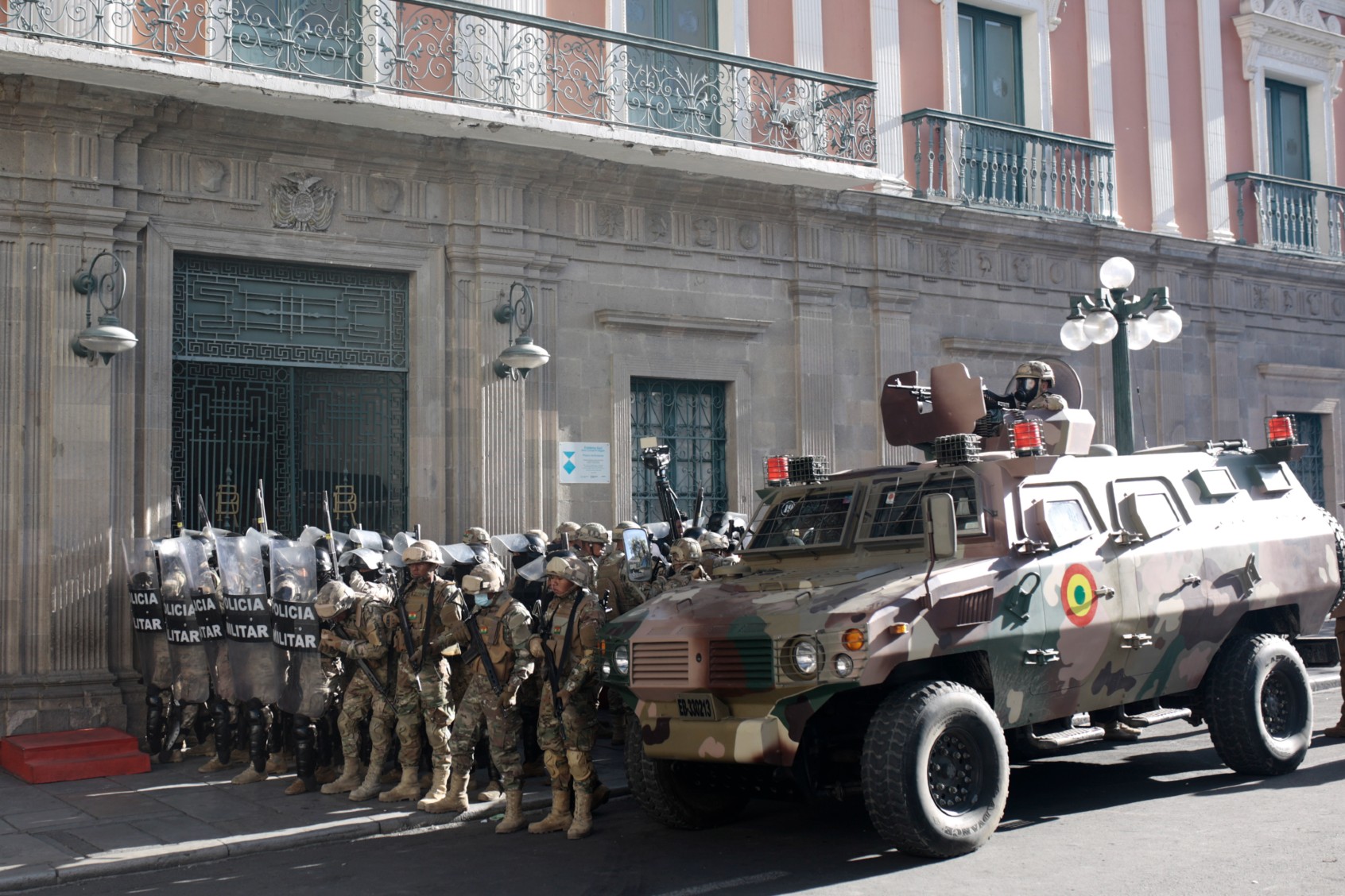 Military members stand guard with an armored truck outside the government palace at Plaza Murillo on June 26, 2024, in La Paz, Bolivia. (Gaston Brito Miserocchi/Getty Images)