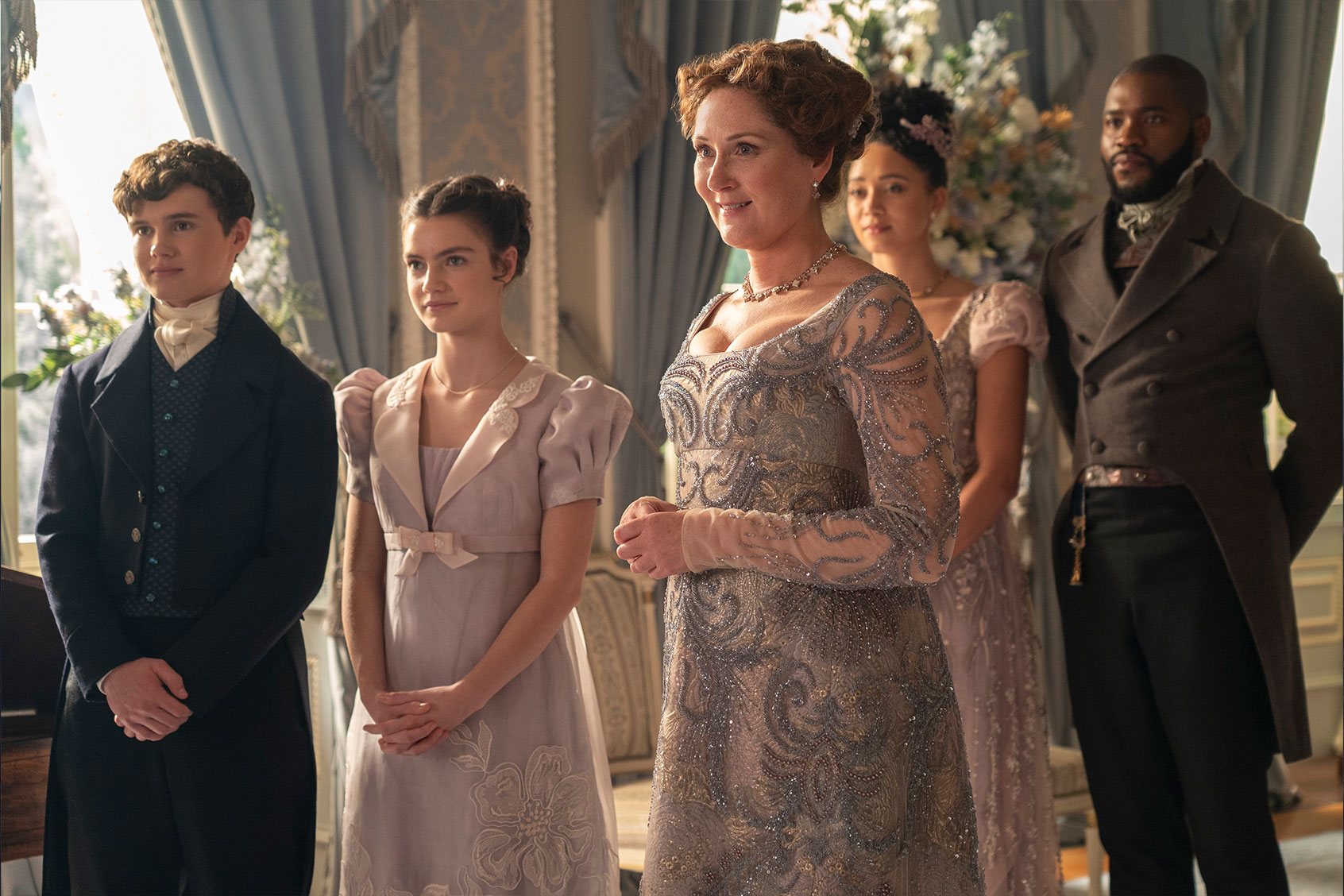 Will Tilston as Gregory Bridgerton, Florence Hunt as Hyacinth Bridgerton, Ruth Gemmell as Lady Violet Bridgerton, Emma Naomi as Alice Mondrich and Martins Imhangbe as Will Mondrich in "Bridgerton" (Netflix)