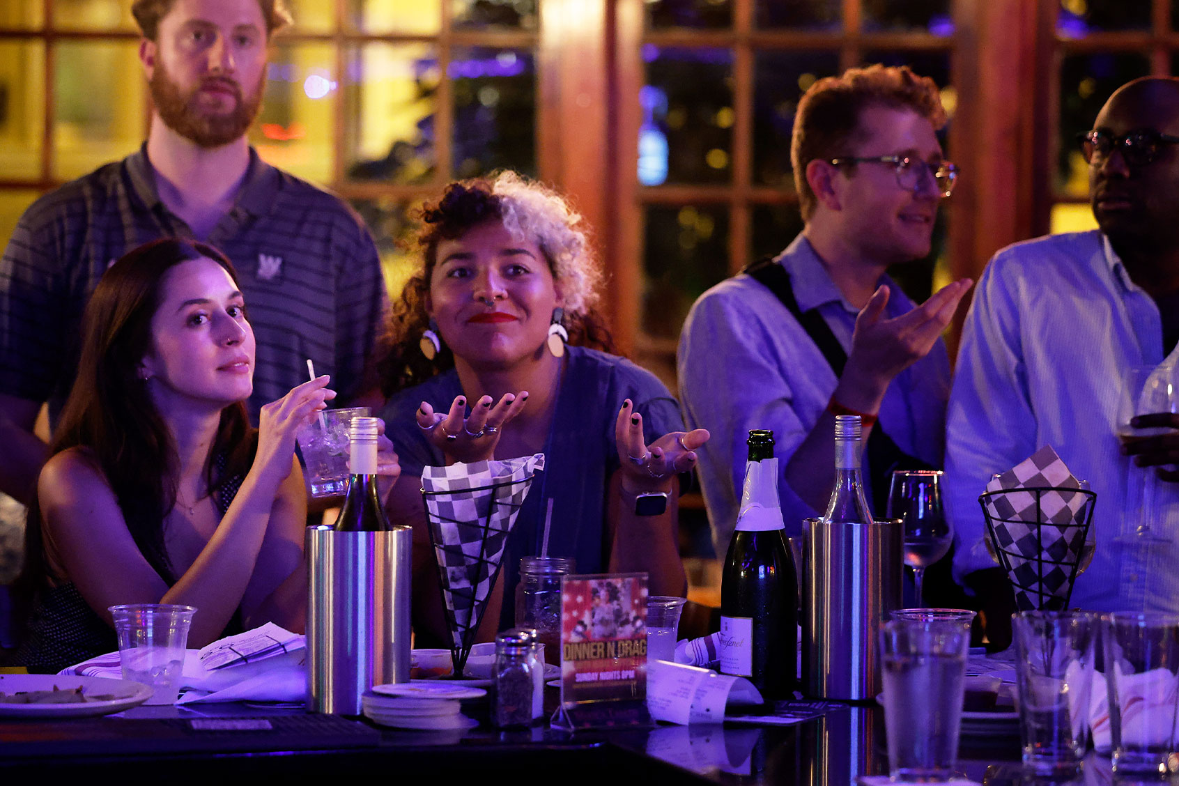 People watch the CNN presidential debate between U.S. President Joe Biden and Republican presidential candidate former President Donald Trump at a debate watch party at Shaws Tavern on June 27, 2024 in Washington, DC. (Chip Somodevilla/Getty Images)