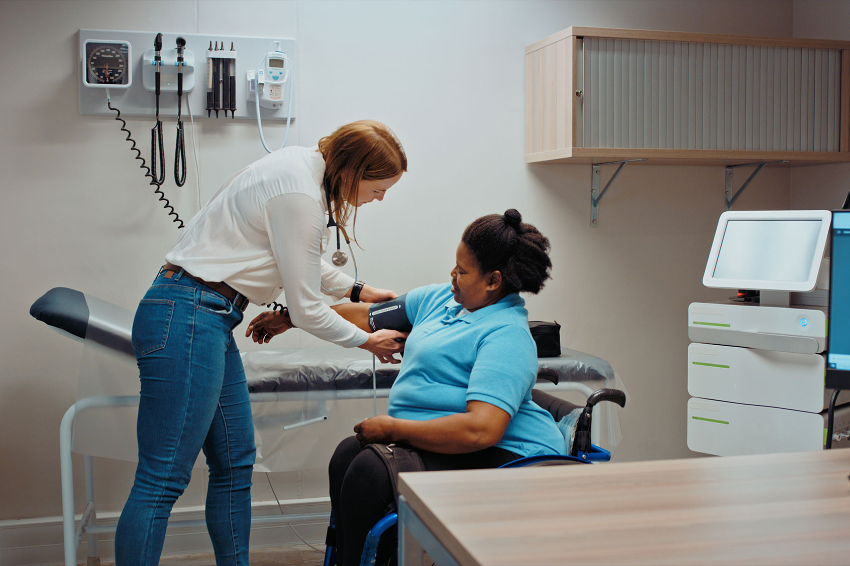 Doctor taking patient blood pressure in hospital examination room. (Getty Images/Kobus Louw)