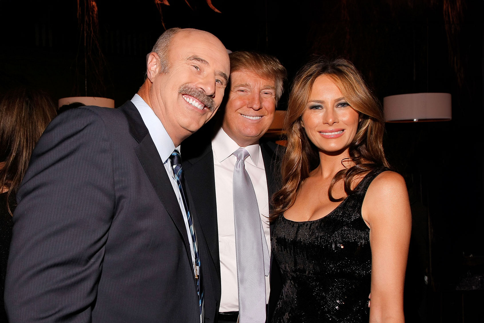 Dr. Phil McGraw, Donald Trump and Melania Trump attend the David Foster Dinner at Bon Appetit Supper Club and Cafe on October 29, 2008 in New York City. (Jemal Countess/WireImage for Bon Appetit Magazine/Getty Images)