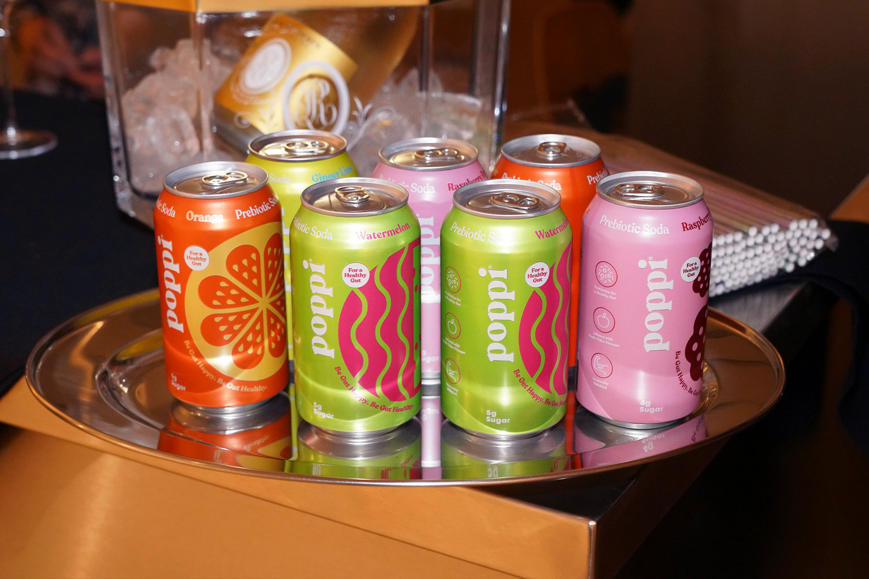 Poppi cans at Places.co Presents Haute Living Celebration of JR With Poppi, Freestream, and Cristal at Swan Miami During Art Basel Miami 2023 on December 07, 2023 in Miami, Florida. (Romain Maurice/Getty Images for Haute Living)