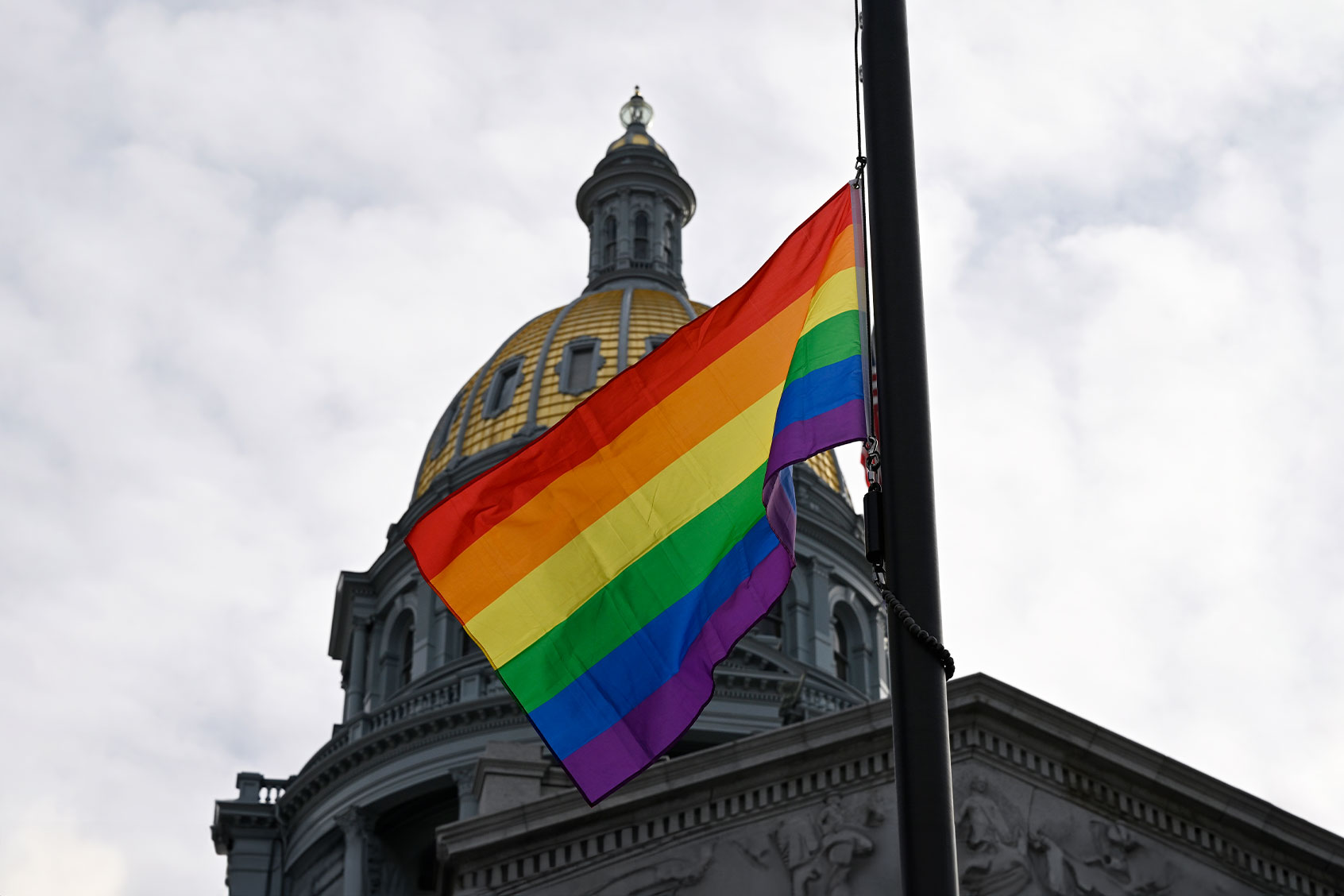 To honor and remember the victims and those injured in the Club Q tragedy a Pride flag flys at half-staff outside the Colorado state capitol for five days on November 23, 2022 in Denver, Colorado. (RJ Sangosti/MediaNews Group/The Denver Post via Getty Images)