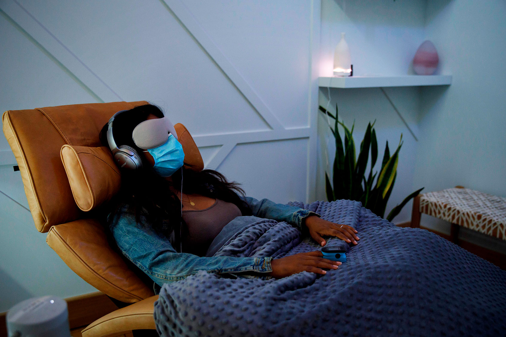 A woman demonstrates what a patient would experience in a therapy room at Field Trip, a psychedelic therapy clinic in Toronto, Ontario, Canada, on August 28, 2020. (COLE BURSTON/AFP via Getty Images)