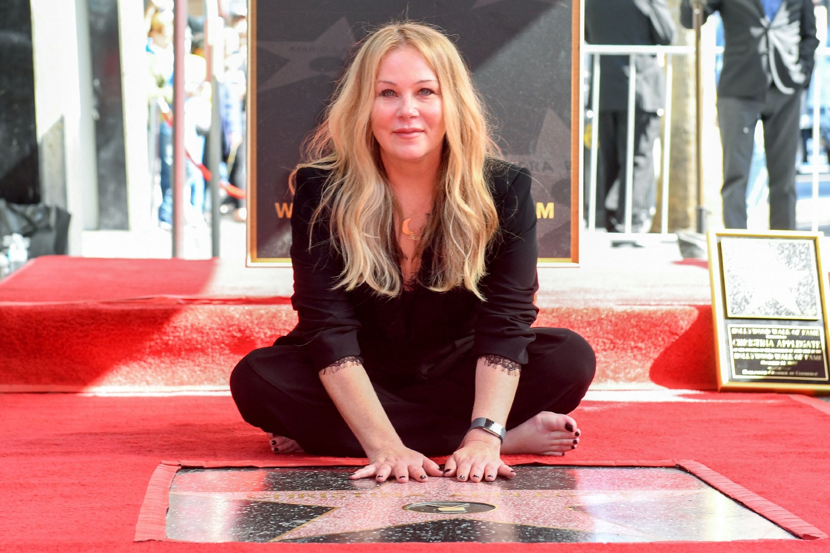 U.S. actress Christina Applegate poses for photos with her newly unveiled Hollywood Walk of Fame star in Hollywood, California, on November 14, 2022. (VALERIE MACON/AFP via Getty Images)