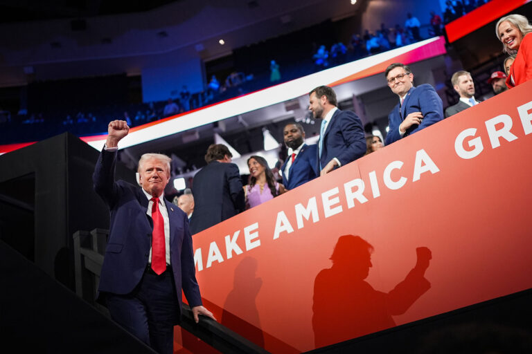 Republican presidential candidate, former U.S. President Donald Trump gestures as (L-R) U.S. Rep. Byron Donalds (R-FL), Republican Vice Presidential candidate, U.S. Sen. J.D. Vance (R-OH), Speaker of the House Mike Johnson (R-LA) and his wife KellyJohnson watch during the first day of the Republican National Convention at the Fiserv Forum on July 15, 2024 in Milwaukee, Wisconsin. (Andrew Harnik/Getty Images)