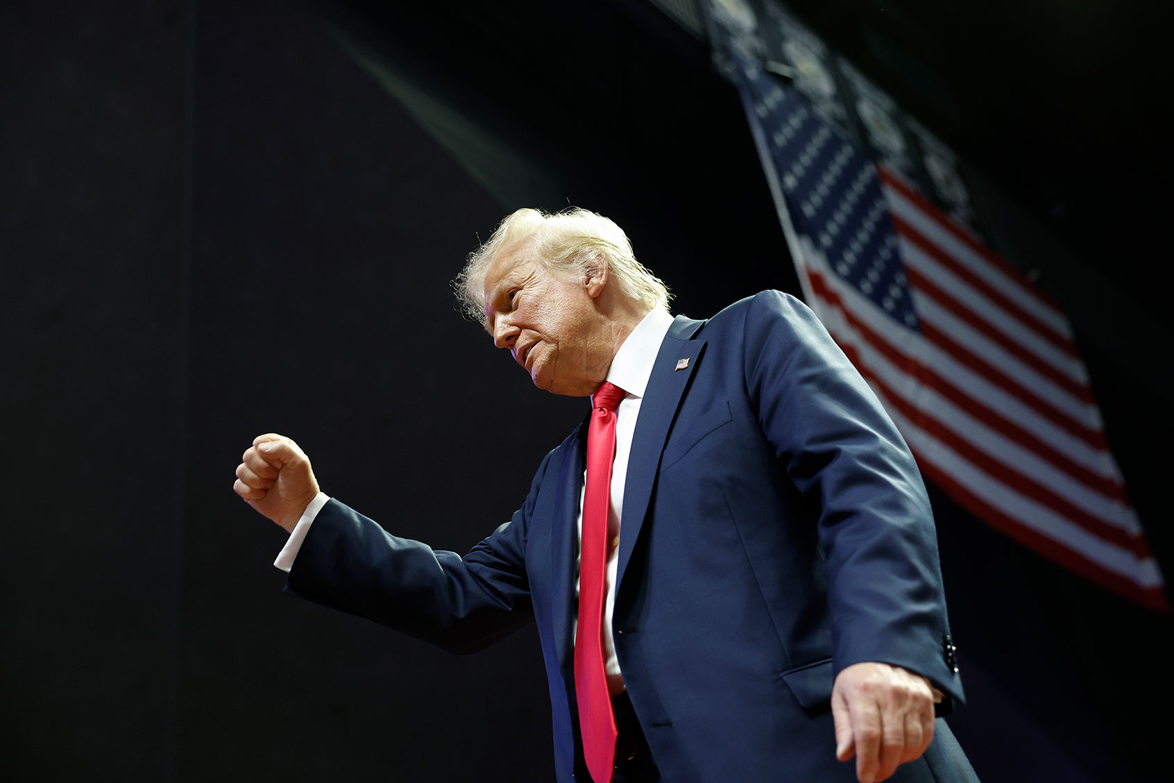 Republican presidential nominee, former U.S. President Donald Trump walks offstage after speaking at a campaign rally at the Van Andel Arena on July 20, 2024 in Grand Rapids, Michigan. (Anna Moneymaker/Getty Images)