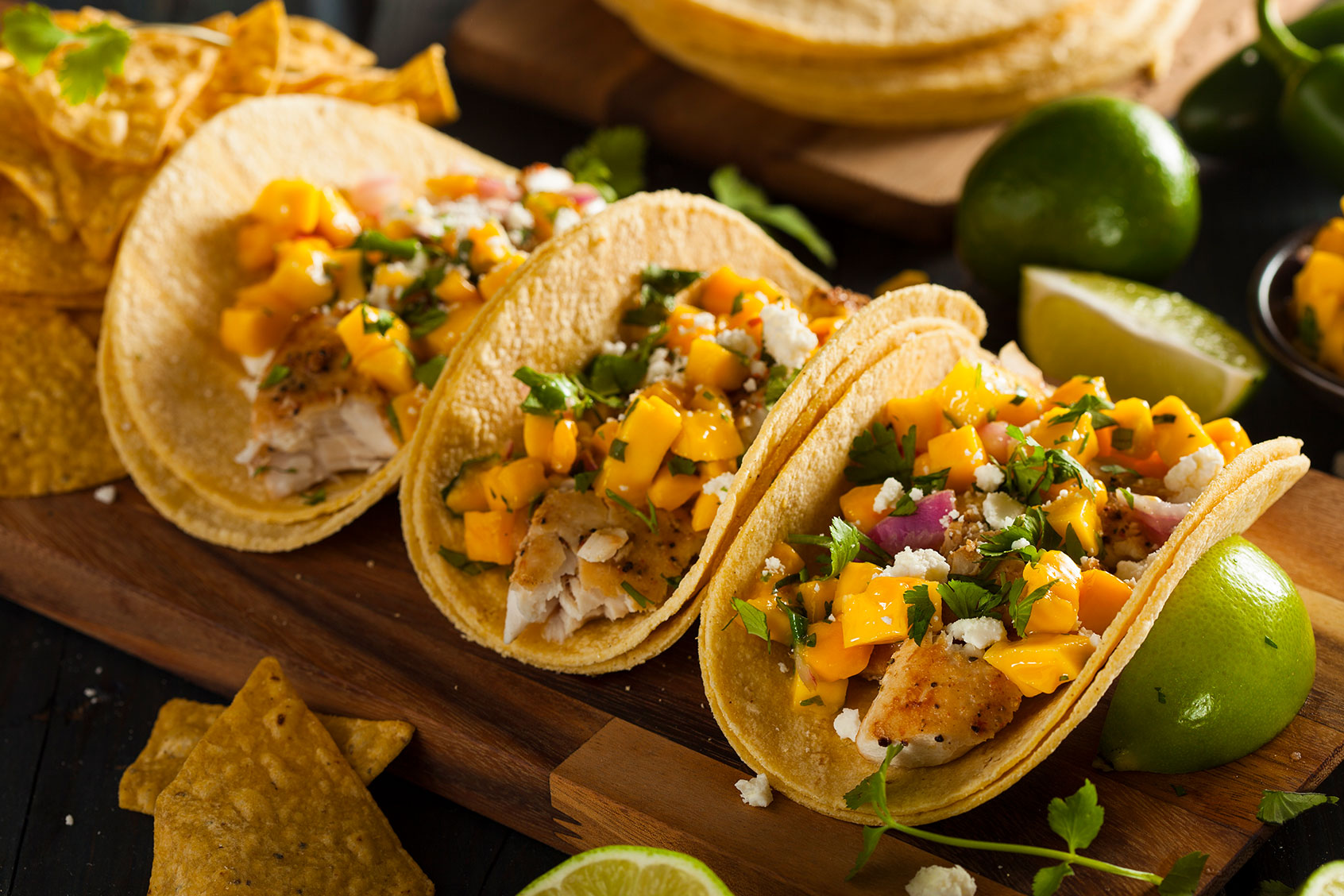 Homemade Baja Fish Tacos with Mango Salsa and Chips (Getty Images/bhofack2)