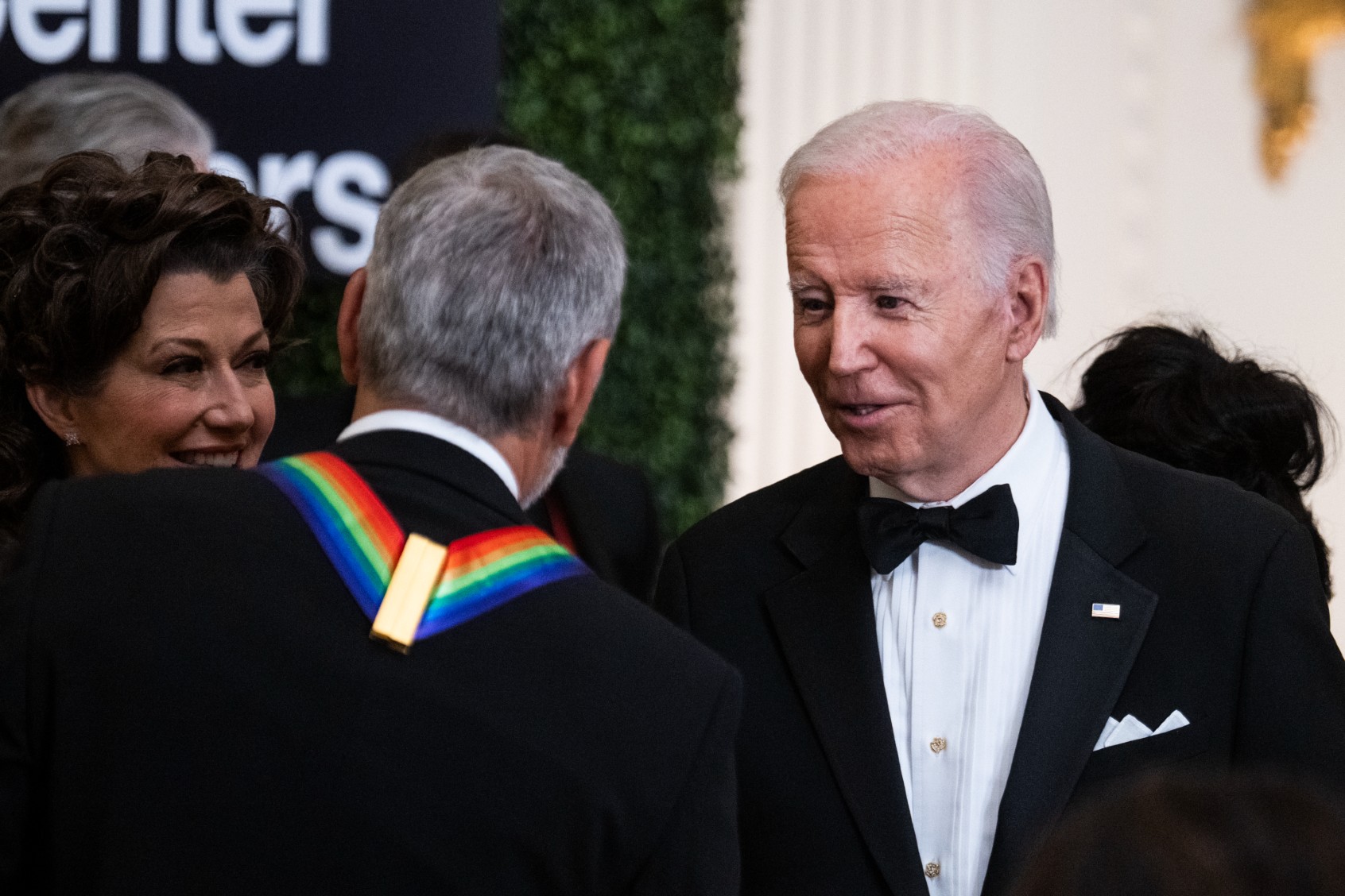 President Joe Biden greets Kennedy Center Honorees Greoge Clooney and Amy Grant during a reception in the East Room of the White House on Sunday, December 4, 2022. (Tom Williams/CQ-Roll Call, Inc via Getty Images)