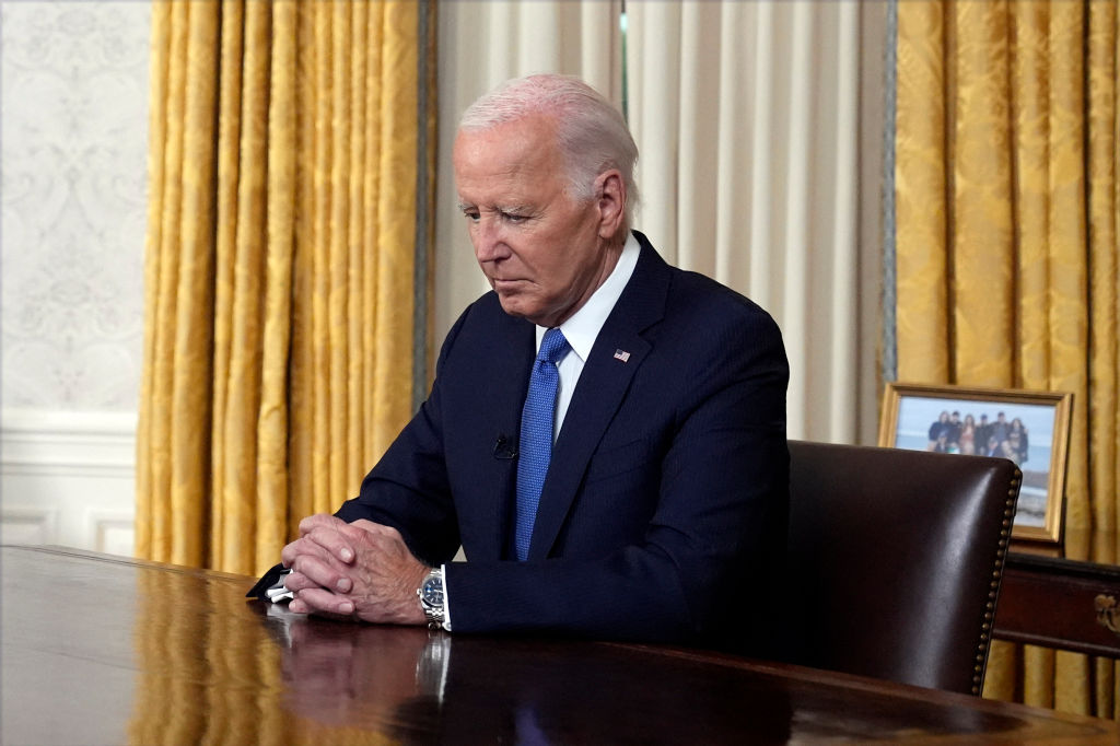 President Joe Biden pauses before addressing the nation about his decision to not seek re-election, in the Oval Office at the White House in Washington, July 24, 2024. (Evan Vucci/POOL/AFP via Getty Images)