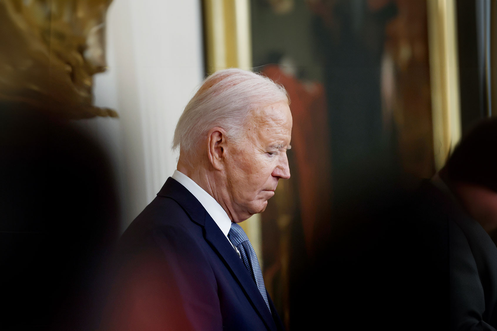 U.S. President Joe Biden bows his head for a prayer during a Medal of Honor ceremony in the East Room of the White House on July 03, 2024 in Washington, DC. (Anna Moneymaker/Getty Images)