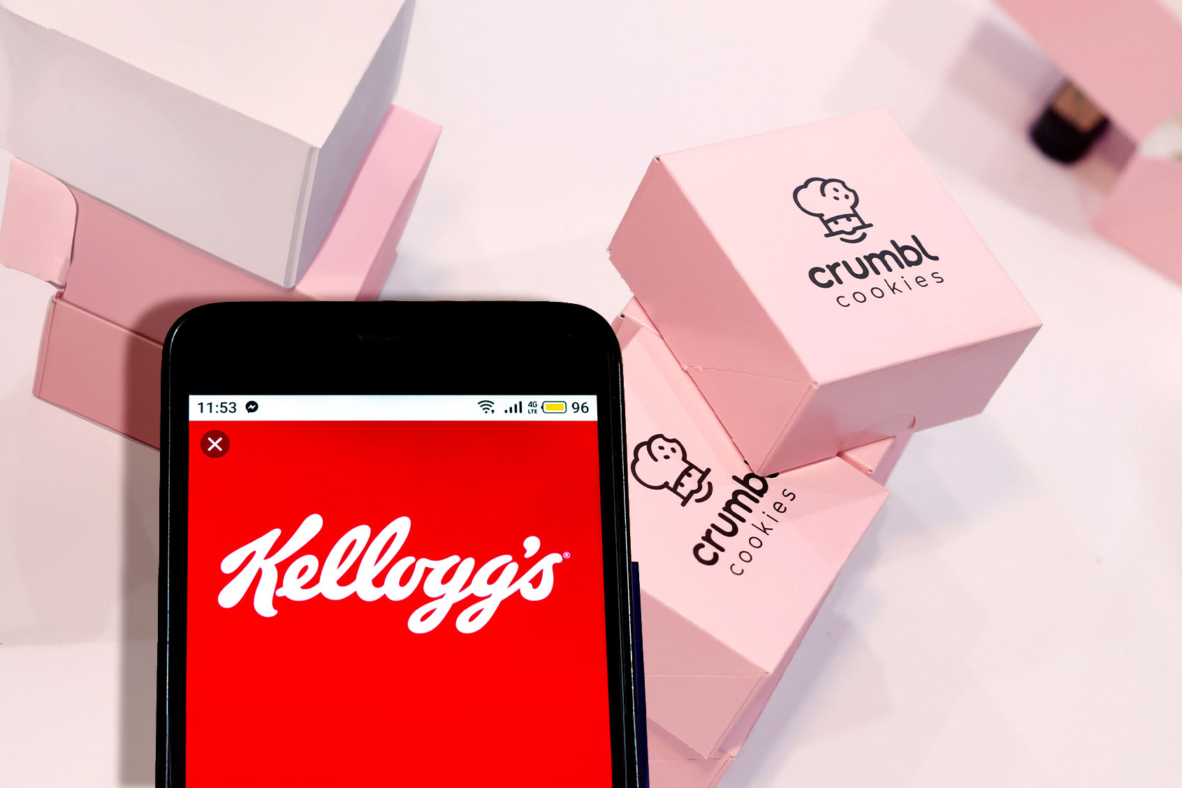 Kellogg's logo and Crumbl Cookie boxes (Photo illustration by Salon/Getty Images)
