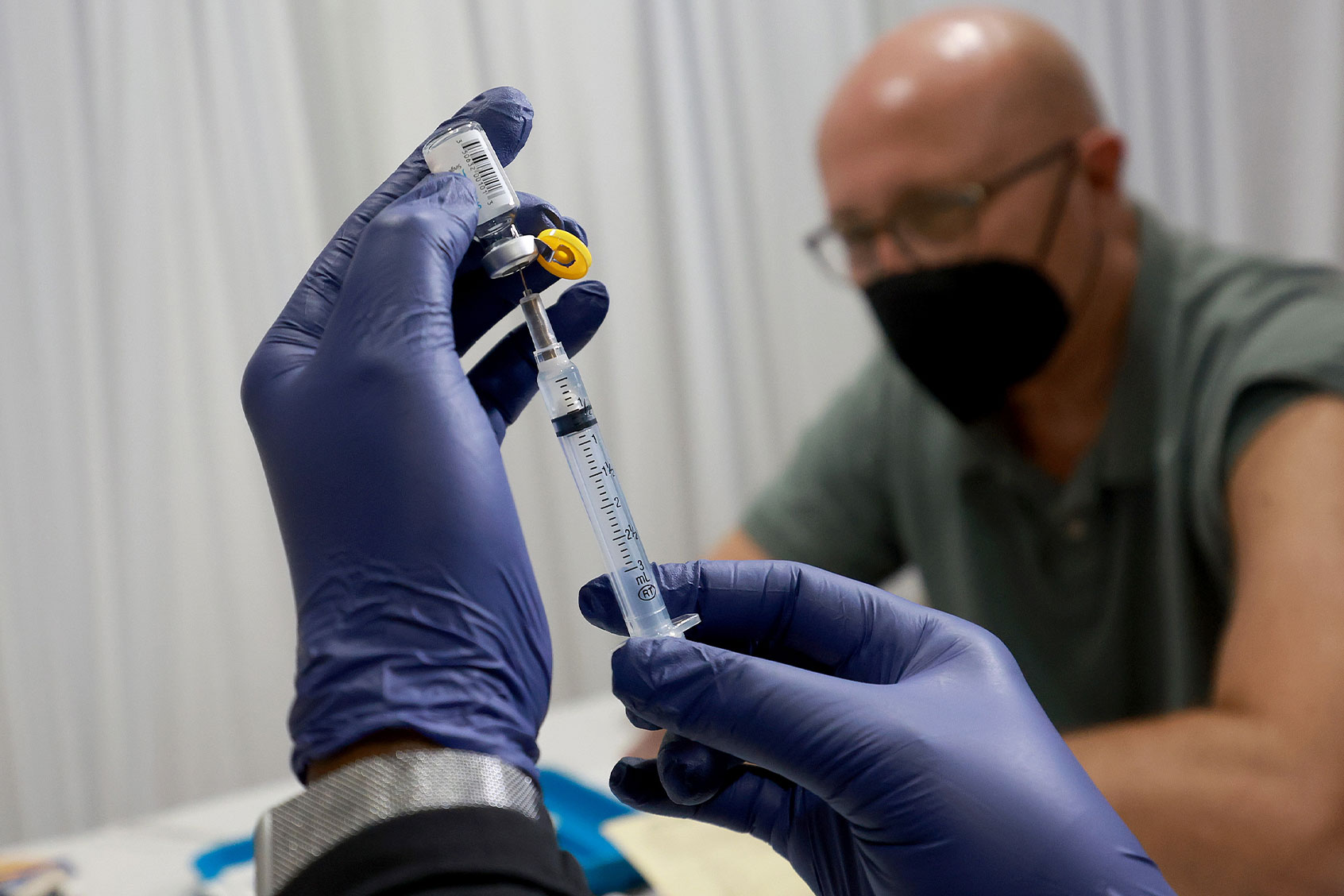 A healthcare worker prepares to administer a vaccine to a patient for the prevention of mpox the Pride Center on July 12, 2022 in Wilton Manors, Florida. (Joe Raedle/Getty Images)