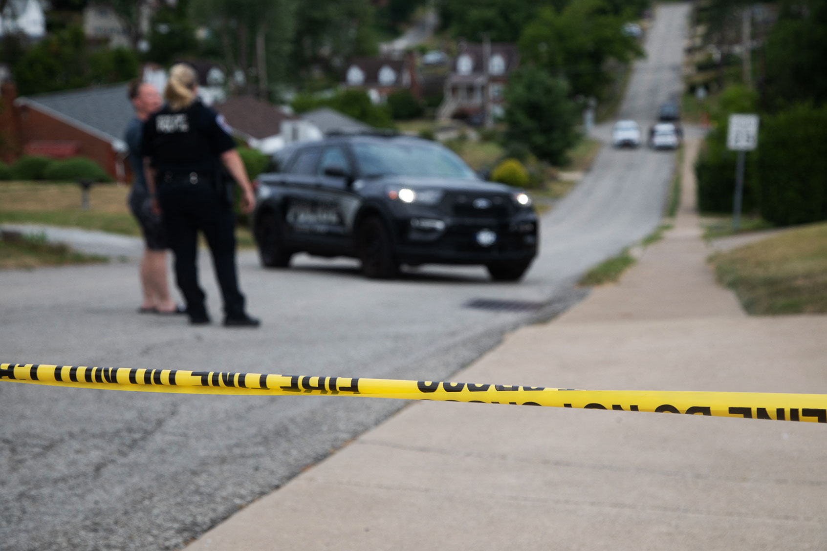 Police continue to block off roads around Thomas Matthew Crooks' home as the FBI carries out its investigation into assassination attempt of former US President Donald Trump, in Bethel Park, Pennsylvania, on July 14, 2024. (REBECCA DROKE/AFP via Getty Images)