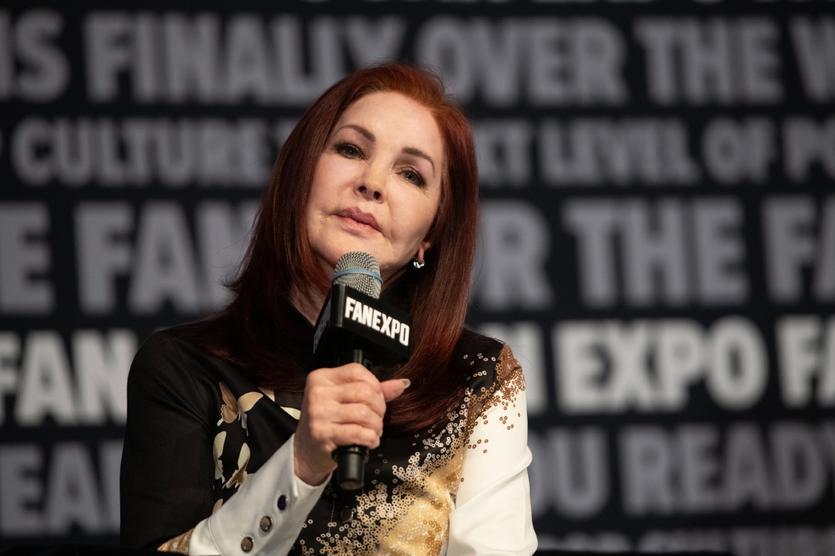 Priscilla Presley speaks to fans about her role in "The Naked Gun" at the 2024 Fan Expo at the Colorado Convention Center on July 06, 2024, in Denver, Colorado. (Thomas Cooper/Getty Images)