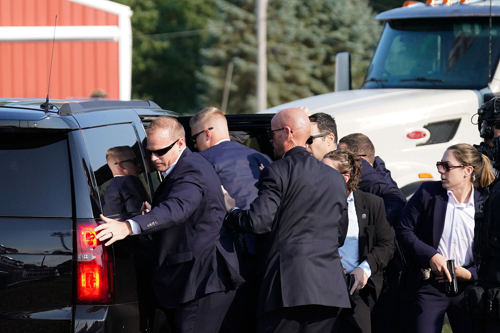Members of Secret Service assist former president Donald Trump into a vehicle during a campaign rally for former President Donald Trump at Butler Farm Show Inc. on Saturday, July 13, 2024 in Butler, Pa. (Jabin Botsford/The Washington Post via Getty Images)