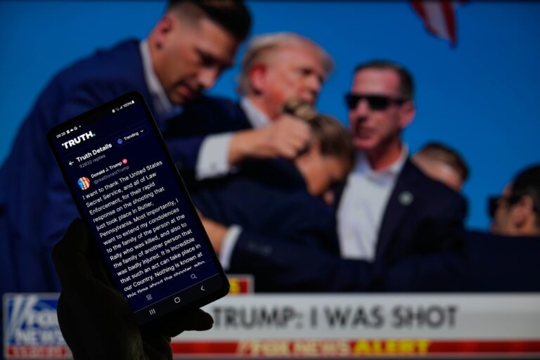 Donald Trump posting on Truth Social after the shooting in Butler, Pennsylvania on July 13, 2024. (Jonathan Raa/NurPhoto via Getty Images)