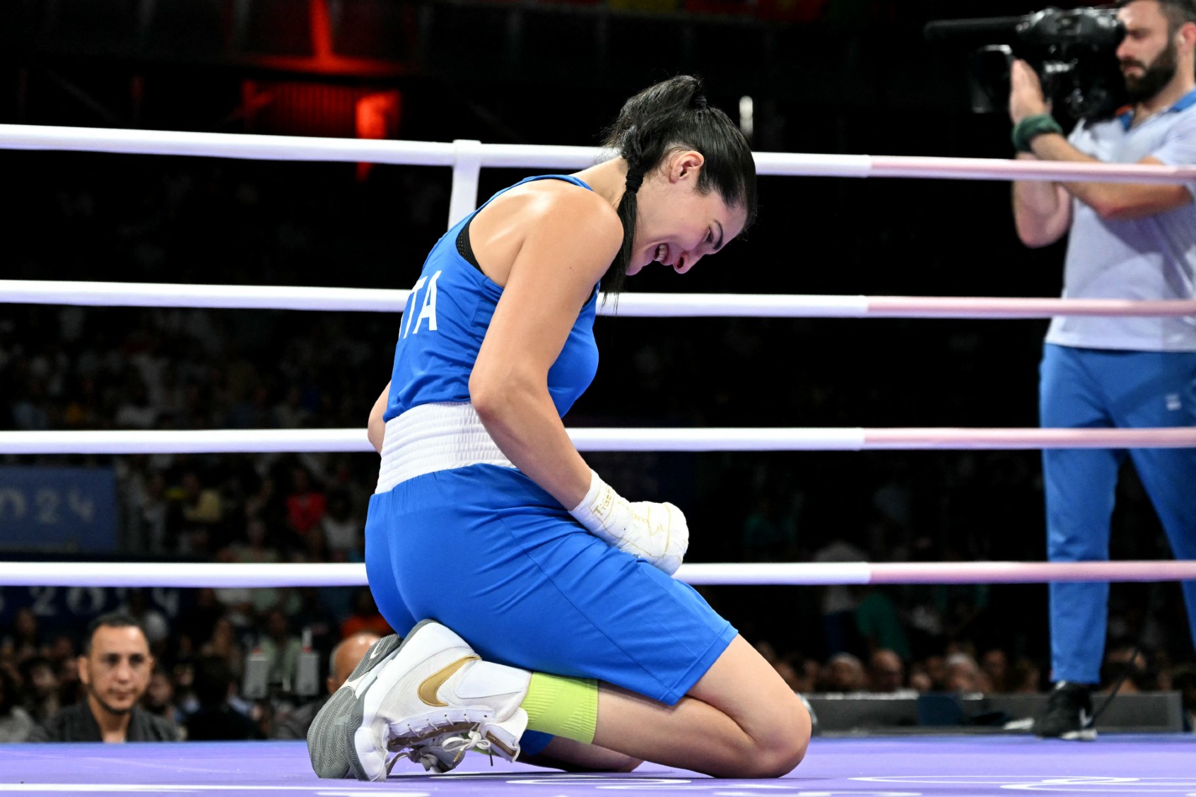 Italy's Angela Carini reacts during her women's 66kg preliminaries round of 16 boxing match against Algeria's Imane Khelif during the Paris 2024 Olympic Games at the North Paris Arena, in Villepinte on August 1, 2024. (MOHD RASFAN/AFP via Getty Images)