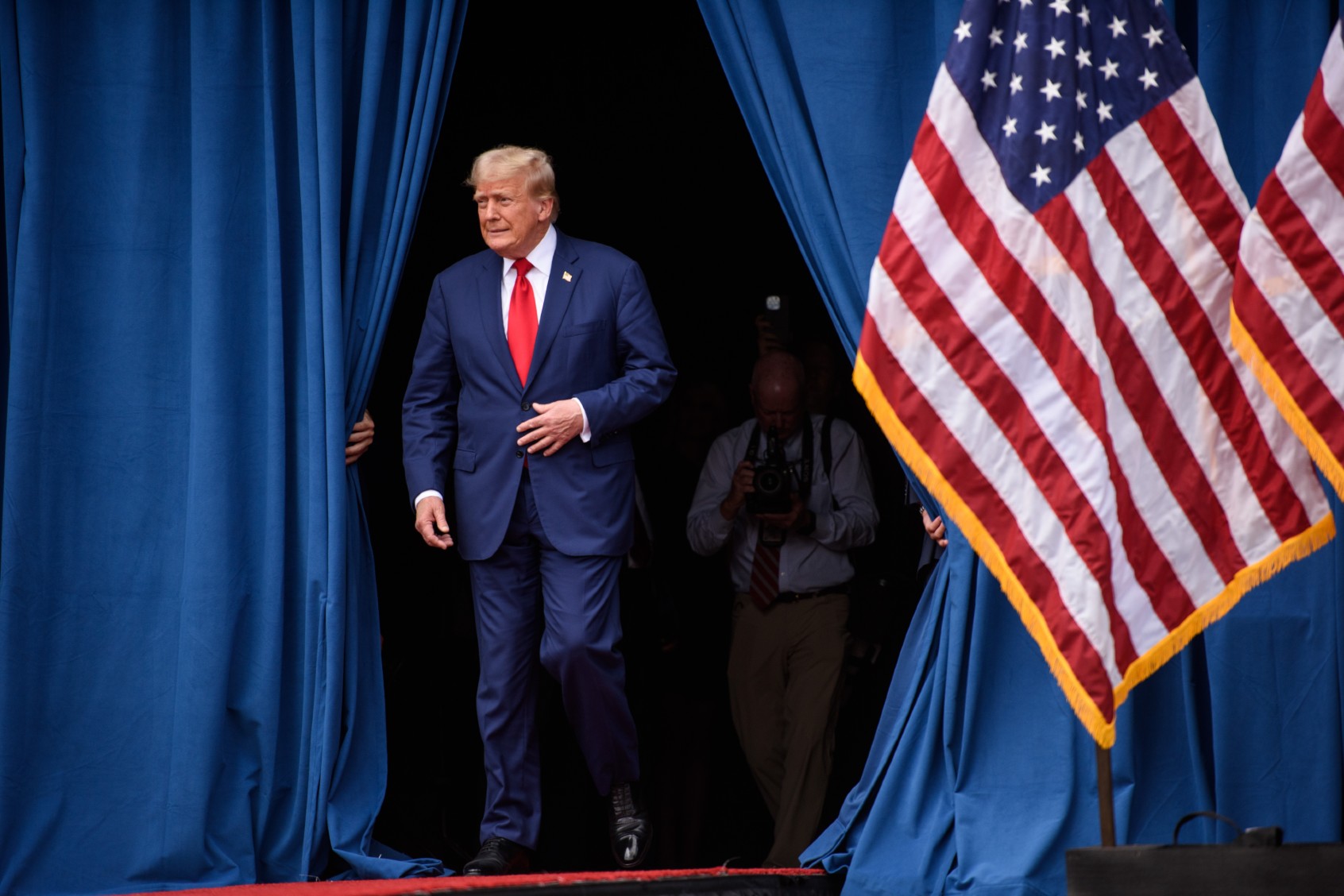 Republican Presidential candidate, former U.S. president, Donald Trump, takes the stage to offer remarks to a crowd during an event on August 21, 2024 in Asheboro, North Carolina at the North Carolina Aviation Museum and Hall of Fame. (Melissa Sue Gerrits/Getty Images)