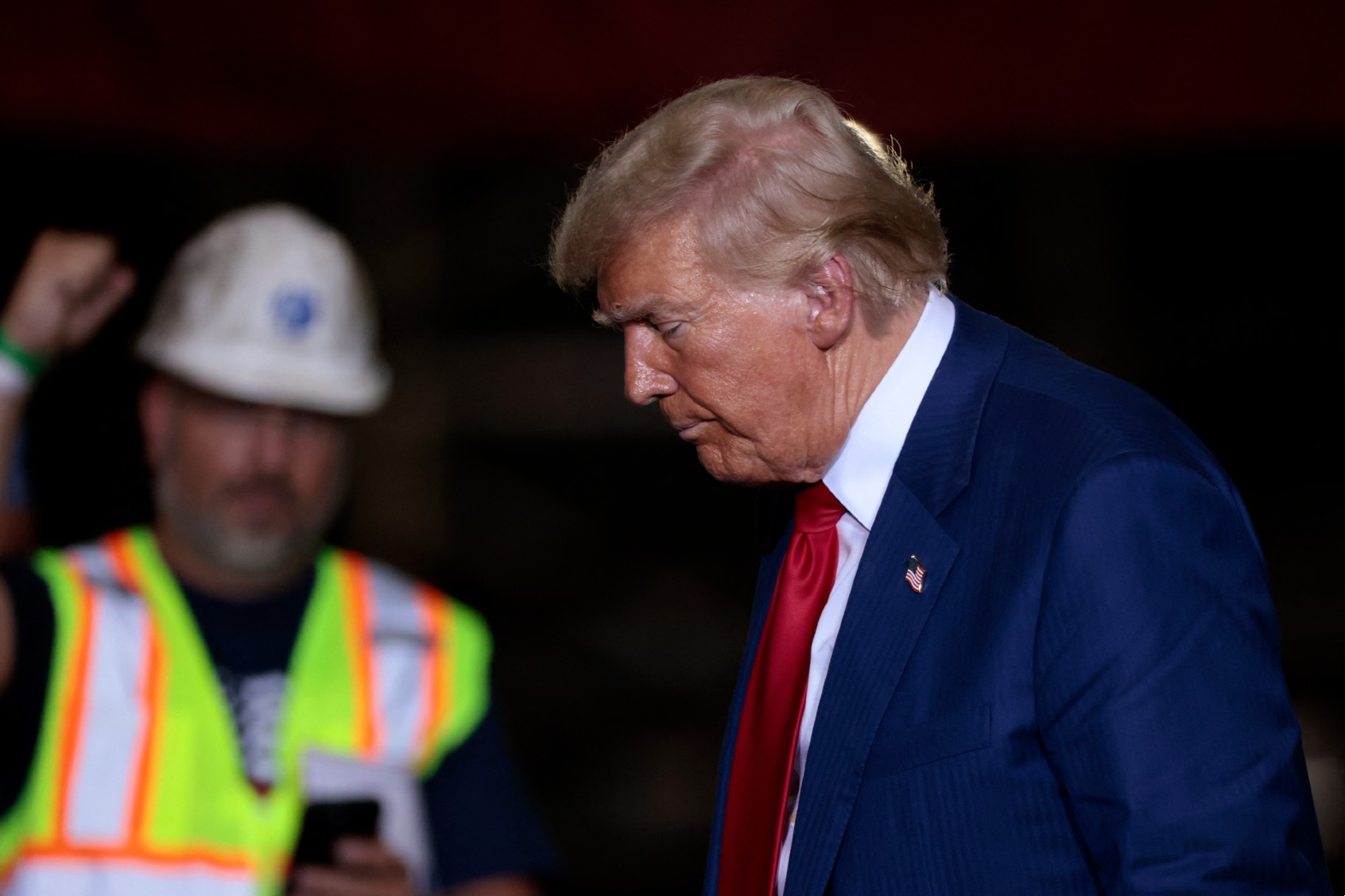 Former US President and Republican presidential candidate Donald Trump arrives to speak about the economy during a campaign event in Potterville, Michigan, on August 29, 2024. (JEFF KOWALSKY/AFP via Getty Images)