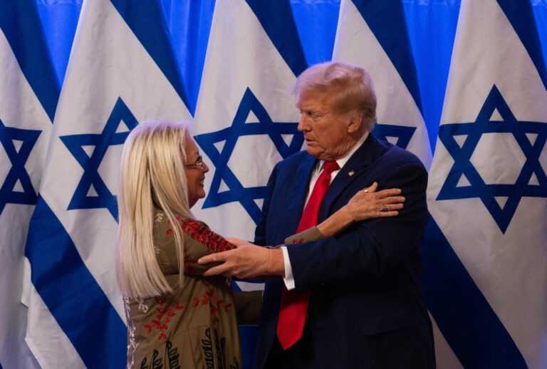 Republican presidential candidate, former U.S. President Donald Trump embraces Miriam Adelson at a fighting anti-semitism event, at the Trump National Golf Club Bedminster on August 15, 2024 in Bedminster, New Jersey. (Adam Gray/Getty Images)