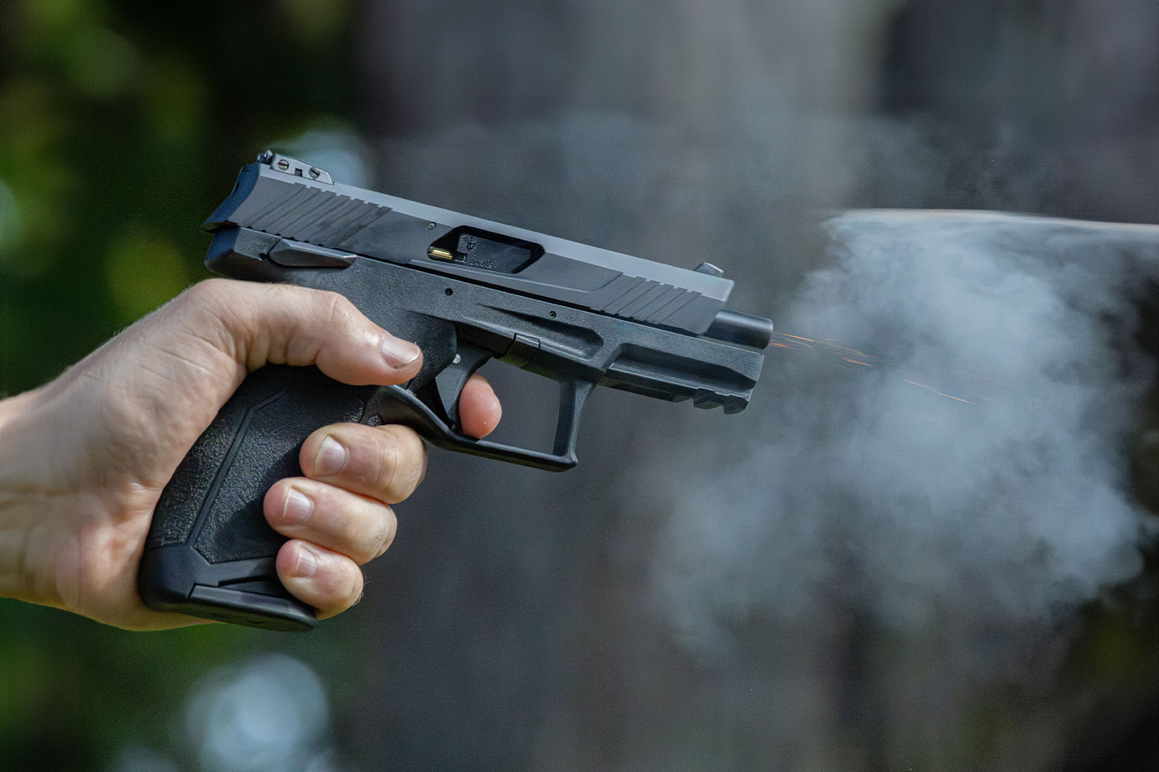 A .22 pistol firing at a target. (Getty Images/Jesse Bacon)