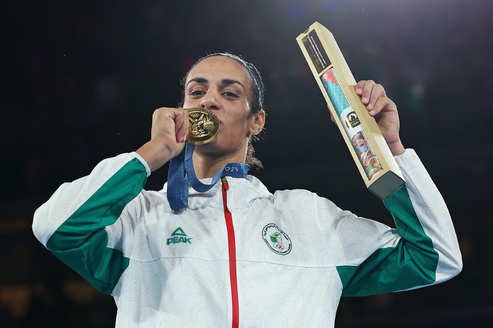 Gold Medallist Imane Khelif of Team Algeria kisses her medal during the Boxing Women's 66kg medal ceremony after the Boxing Women's 66kg Final match on day fourteen of the Olympic Games Paris 2024 at Roland Garros on August 09, 2024, in Paris, France. (Richard Pelham/Getty Images)