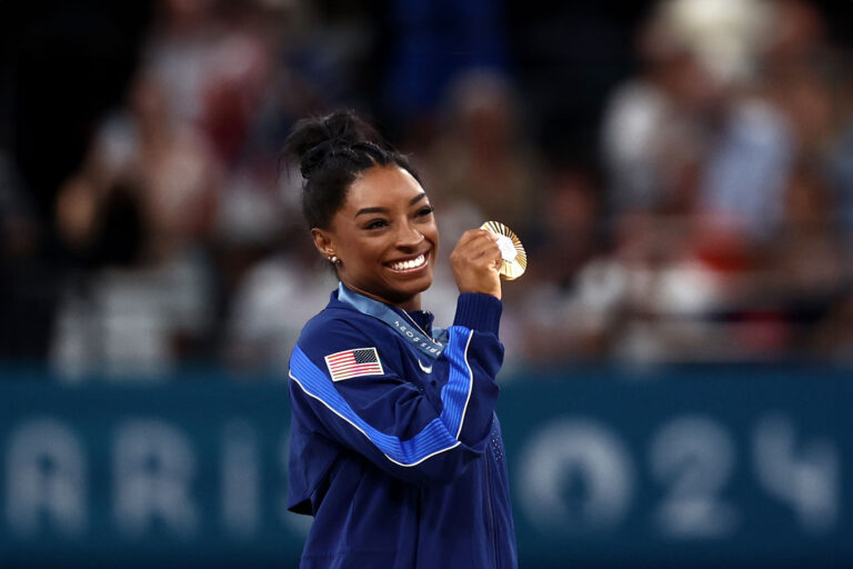 Gold medalist Simone Biles of Team United States poses with her medal after competing in the Artistic Gymnastics Women's All-Around Final on day six of the Olympic Games Paris 2024 at Bercy Arena on August 01, 2024 in Paris, France. (Naomi Baker/Getty Images)