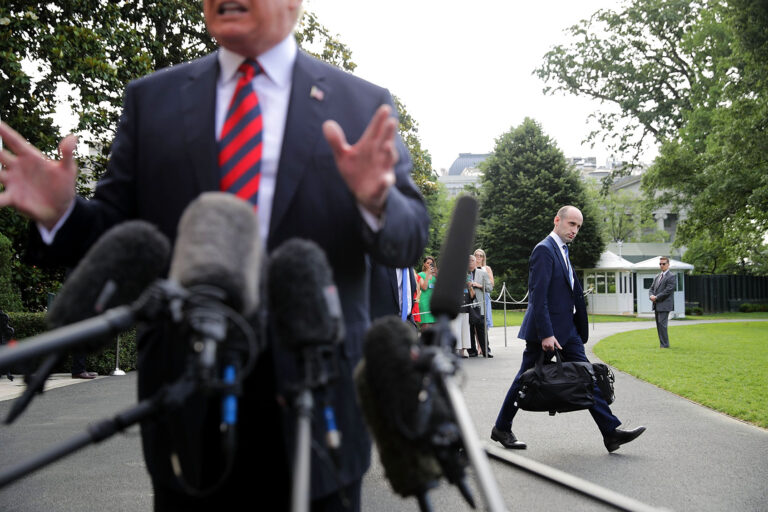 Senior Advisor to the President Stephen Miller (R) walks behind U.S. President Donald Trump as he talks to reporters before they depart the White House June 8, 2018 in Washington, DC. (Chip Somodevilla/Getty Images)