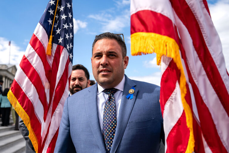 Rep. Michael Lawler (R-NY) and Rep. Anthony D'Esposito (R-NY) hold American flags as they counterprotest Congressional aides advocating for a cease-fire in the war between Israel and Hamas at the U.S. Capitol on May 16, 2024 in Washington, DC. (Kent Nishimura/Getty Images)