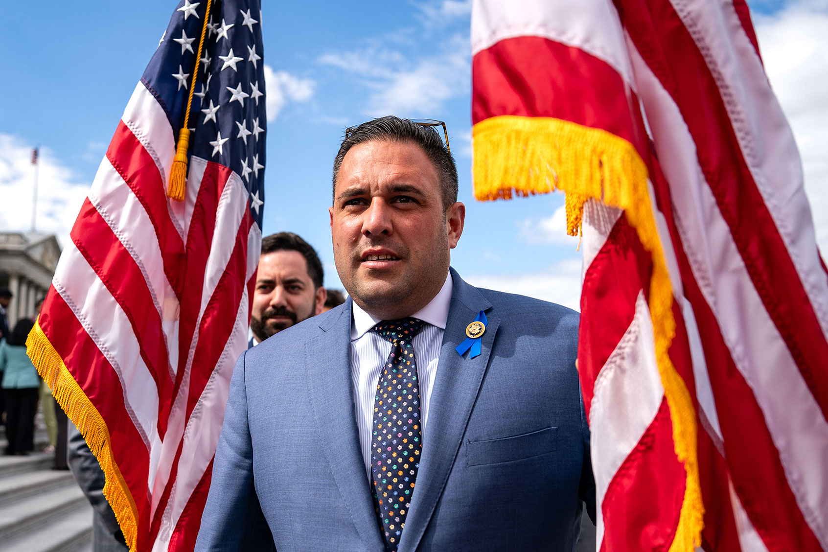 Rep. Michael Lawler (R-NY) and Rep. Anthony D'Esposito (R-NY) hold American flags as they counterprotest Congressional aides advocating for a cease-fire in the war between Israel and Hamas at the U.S. Capitol on May 16, 2024 in Washington, DC. (Kent Nishimura/Getty Images)