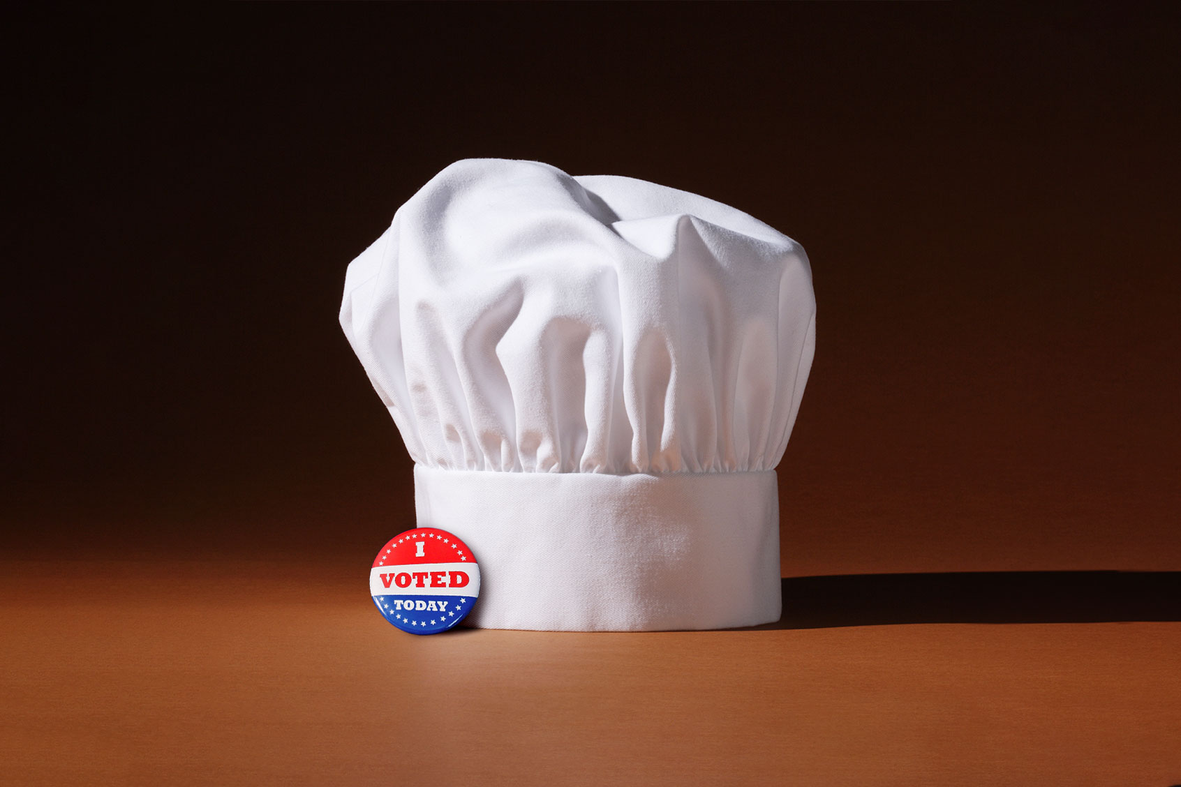 A chef's hat and an "I Voted Today" pin (Photo illustration by Salon/Getty Images)