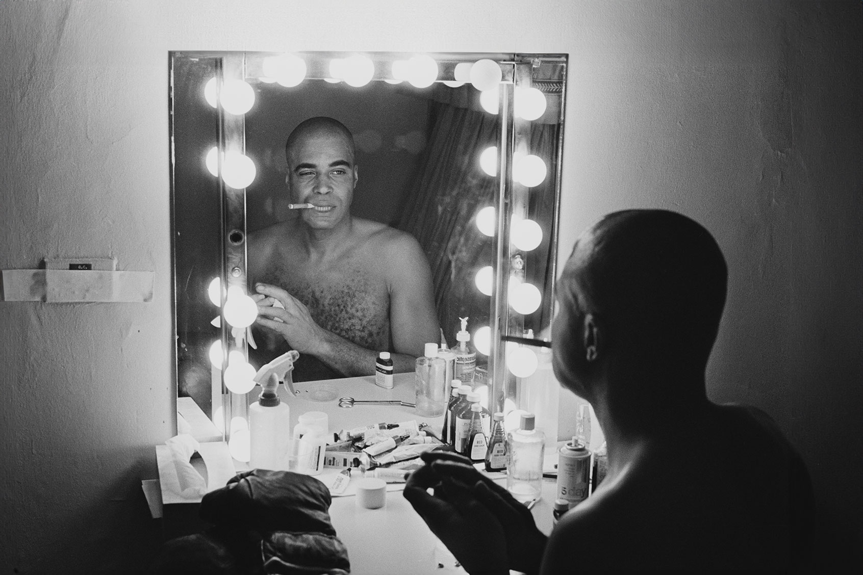 American actor James Earl Jones looking at his reflection in a mirror in a dressing room before going on stage to appear in the play 'The Great White Hope' as 'Jack Jefferson', Broadway, US, 10th December 1968. (Harry Benson/Daily Express/Getty Images)