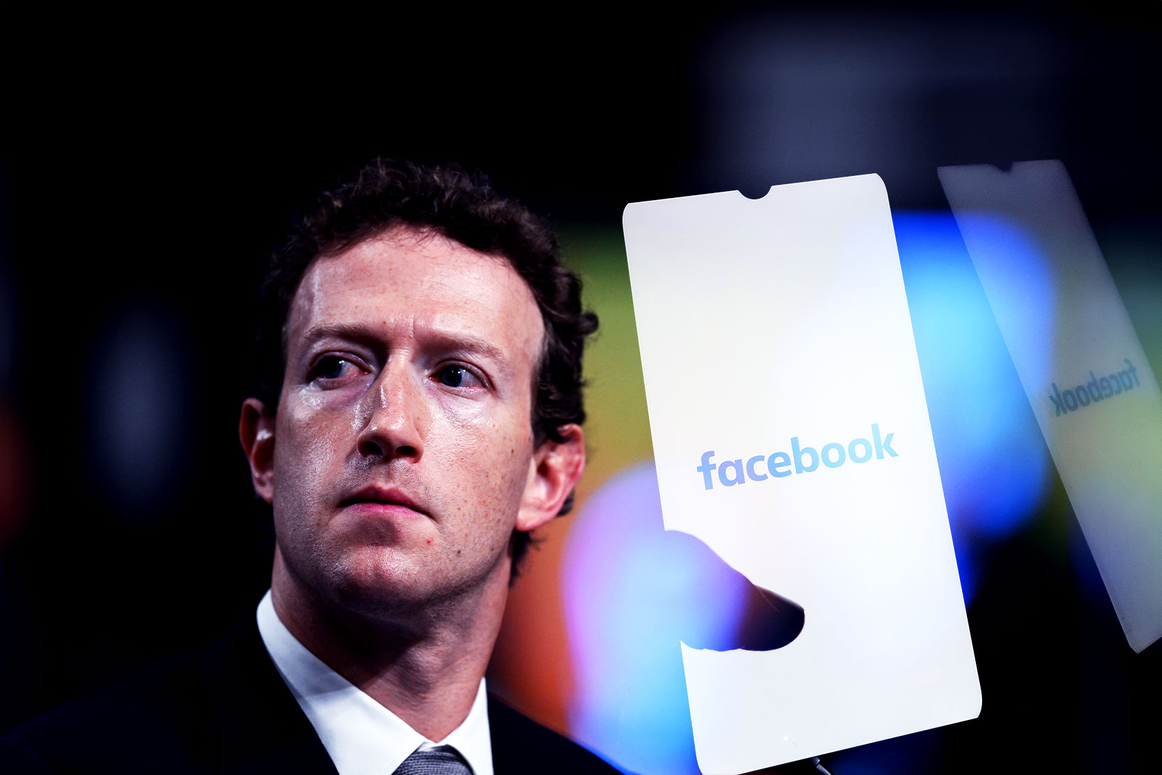 Mark Zuckerberg and the Facebook logo displayed on a smartphone screen (Photo illustration by Salon/Getty Images)