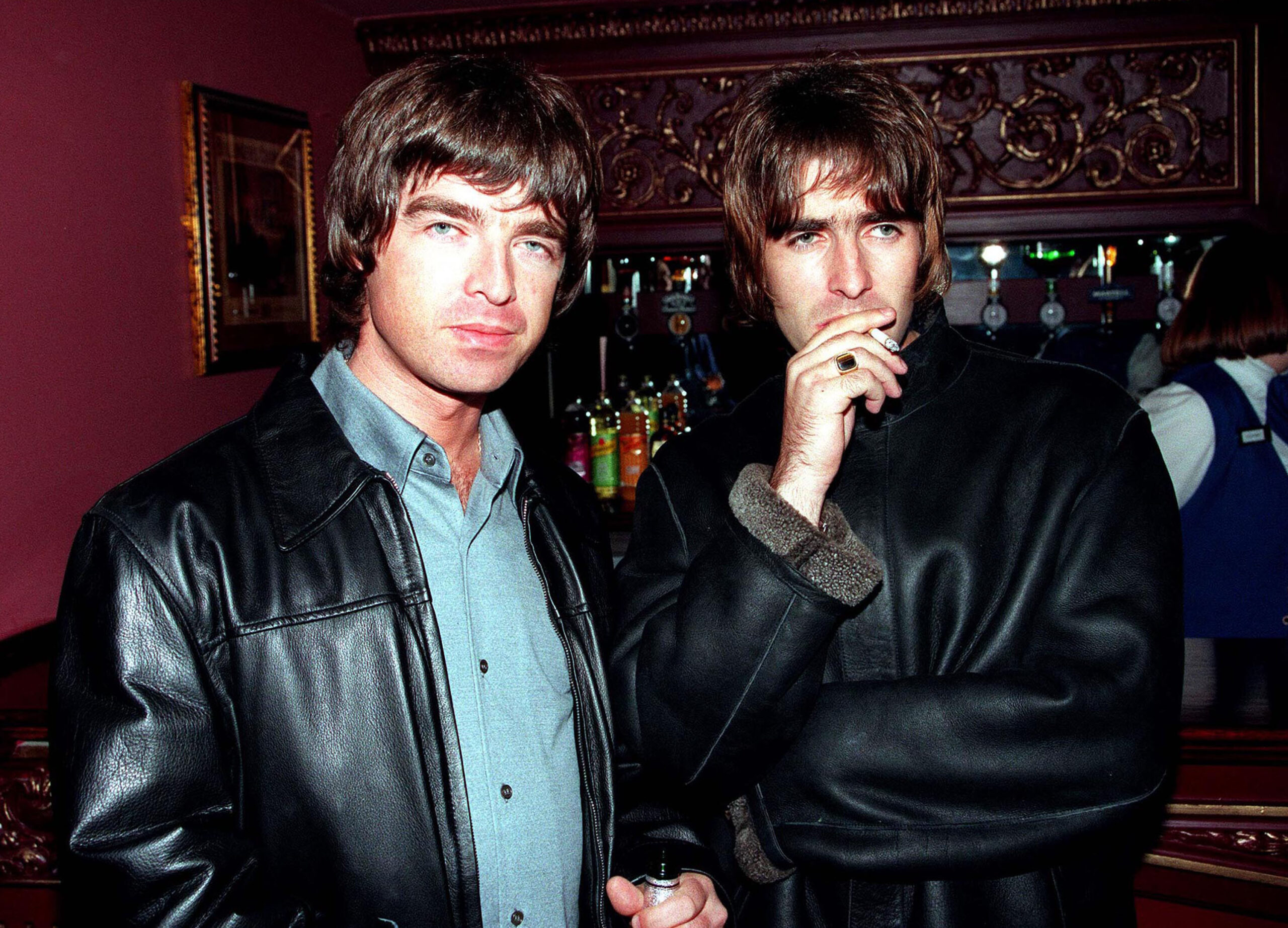 LONDON - 1995: Oasis lead singer Liam Gallagher and brother Noel Gallagher at the opening night of Steve Coogan's comedy show in the West End, London. (Dave Hogan/Getty Images)