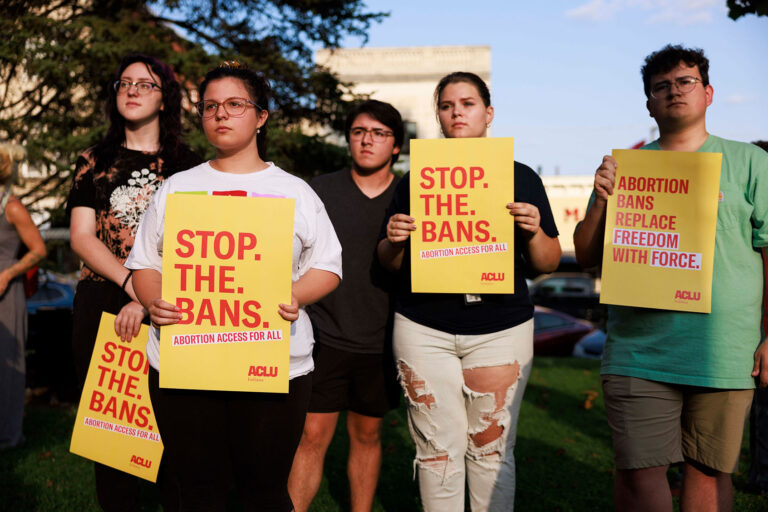 Abortion rights activists gather at the Monroe County Courthouse for a protest vigil a few hours before Indianas near total abortion ban goes into effect in Bloomington. (Jeremy Hogan/SOPA Images/LightRocket via Getty Images)
