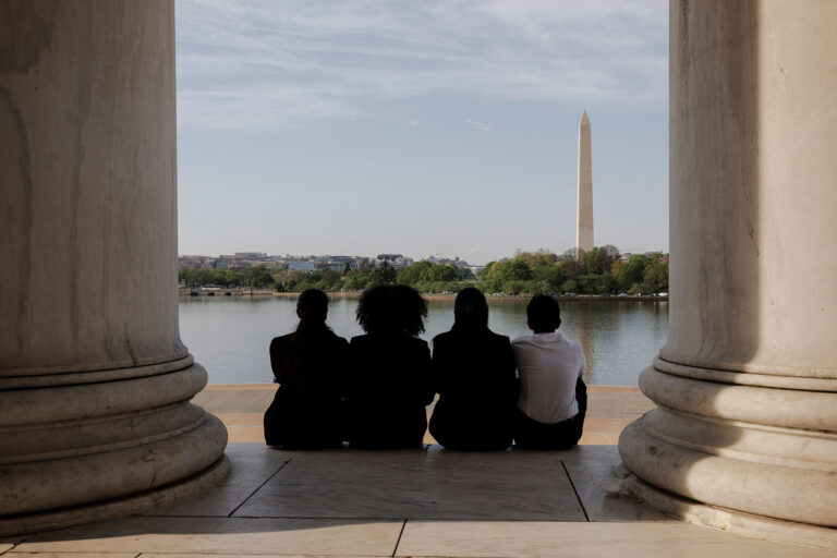 Four competitors in the We the People national championship viewed the Washington Monument from the Thomas Jefferson Memorial in Washington, D.C. (Moriah Ratner/Retro Report/PBS)