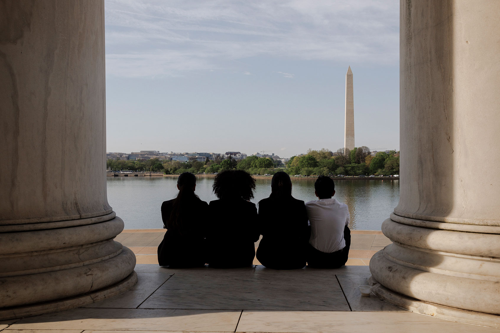 Four competitors in the We the People national championship viewed the Washington Monument from the Thomas Jefferson Memorial in Washington, D.C. (Moriah Ratner/Retro Report/PBS)