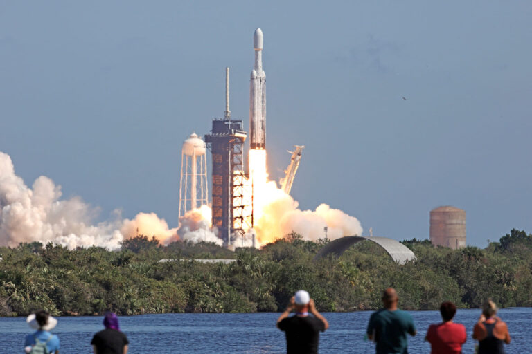 A SpaceX Falcon Heavy rocket with the Europa Clipper spacecraft aboard launches from Launch Complex 39A at NASA's Kennedy Space Center in Cape Canaveral on October 14, 2024. The spacecraft Clipper will soon launch for Jupiter's moon Europa, one of dozens of moons orbiting the Solar System's biggest planet and the nearest spot in our celestial neighborhood that could offer a perch for life. It should reach orbit around Jupiter and Europa in 2031, where it will begin a detailed study of the moon scientists believe is covered in frozen water, which could provide a similar habitat to Earth. (Photo by Gregg Newton / AFP) (Photo by GREGG NEWTON/AFP via Getty Images)