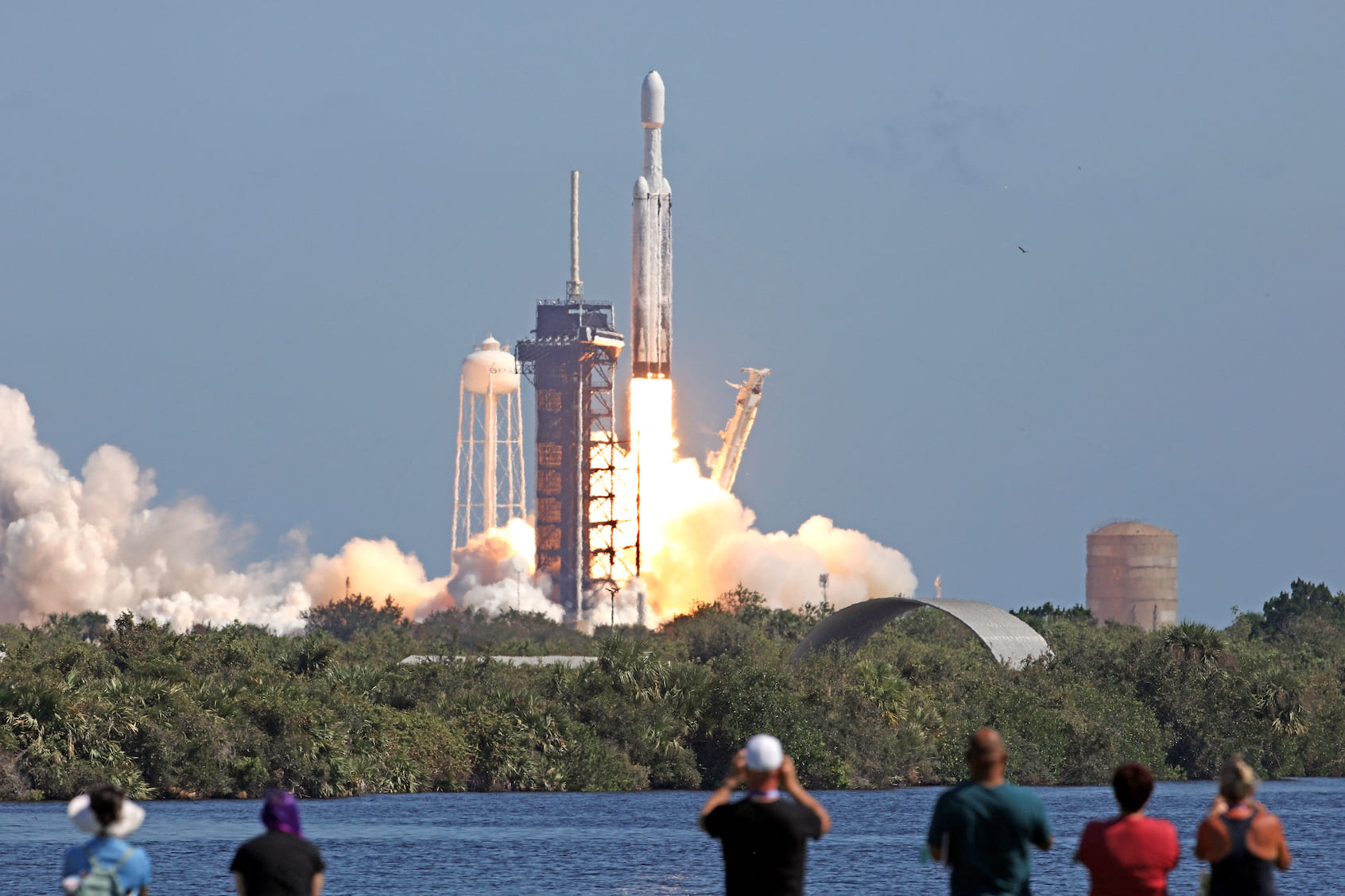 A SpaceX Falcon Heavy rocket with the Europa Clipper spacecraft aboard launches from Launch Complex 39A at NASA's Kennedy Space Center in Cape Canaveral on October 14, 2024. The spacecraft Clipper will soon launch for Jupiter's moon Europa, one of dozens of moons orbiting the Solar System's biggest planet and the nearest spot in our celestial neighborhood that could offer a perch for life. It should reach orbit around Jupiter and Europa in 2031, where it will begin a detailed study of the moon scientists believe is covered in frozen water, which could provide a similar habitat to Earth. (Photo by Gregg Newton / AFP) (Photo by GREGG NEWTON/AFP via Getty Images)