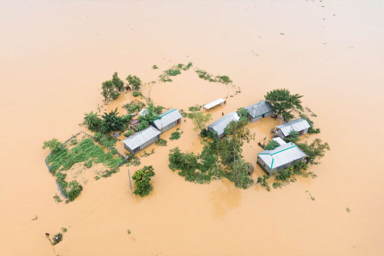 Heavy rains and water from upstream India submerge homes in a village in Jhenaigati upazila of Sherpur district, Bangladesh, on October 5, 2024. (Muhammad Amdad Hossain/NurPhoto via Getty Images)