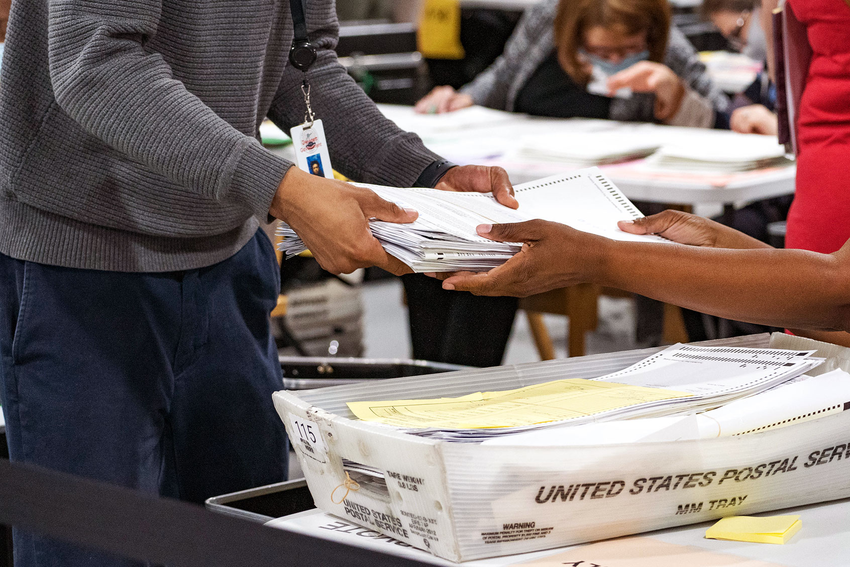 Gwinnett County election workers handle ballots as part of the recount for the 2020 presidential election at the Beauty P. Baldwin Voter Registrations and Elections Building on November 16, 2020 in Lawrenceville, Georgia. (Megan Varner/Getty Images)